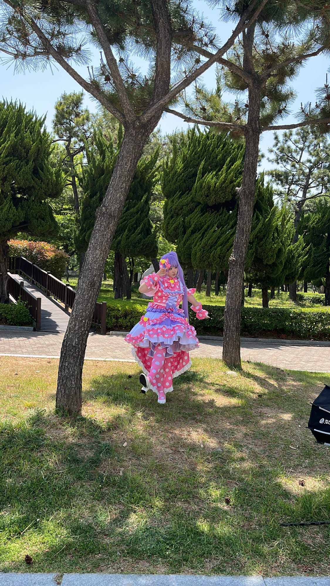 Magical girl cosplayer in pink and purple tiered dress at BEXCO