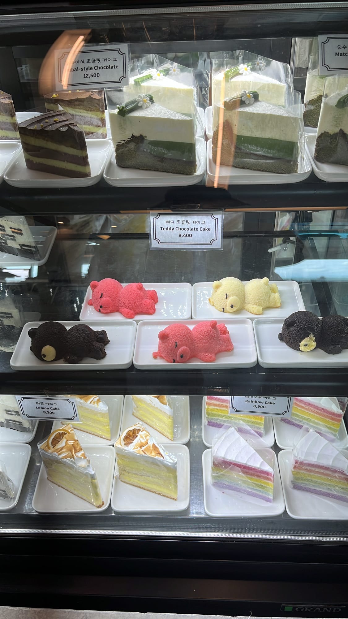 Cute teddy bear chocolate cakes and artisan pastry slices at Coralani Busan