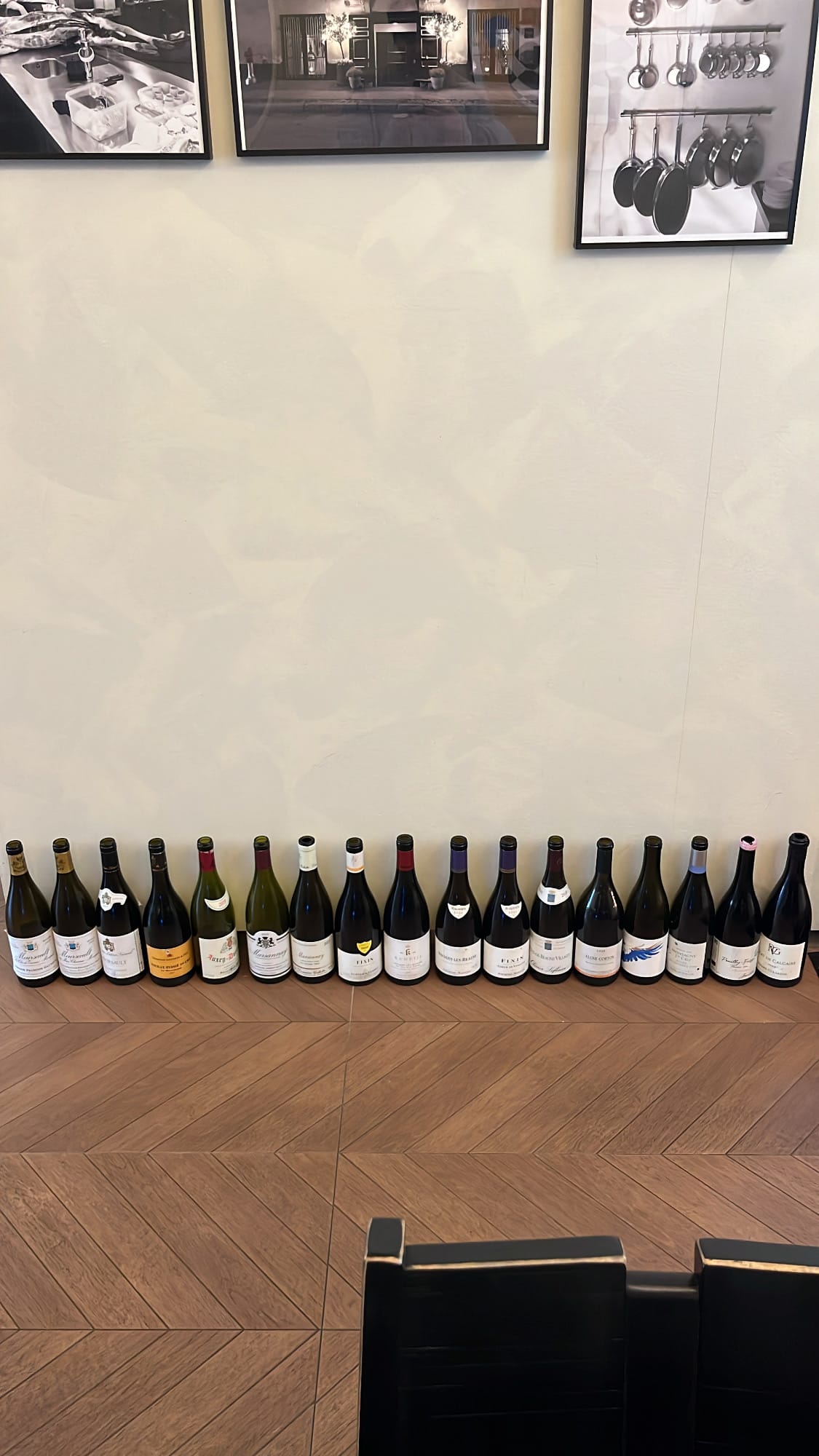 Danicci decorative row of emptied wine bottles along the wood floor