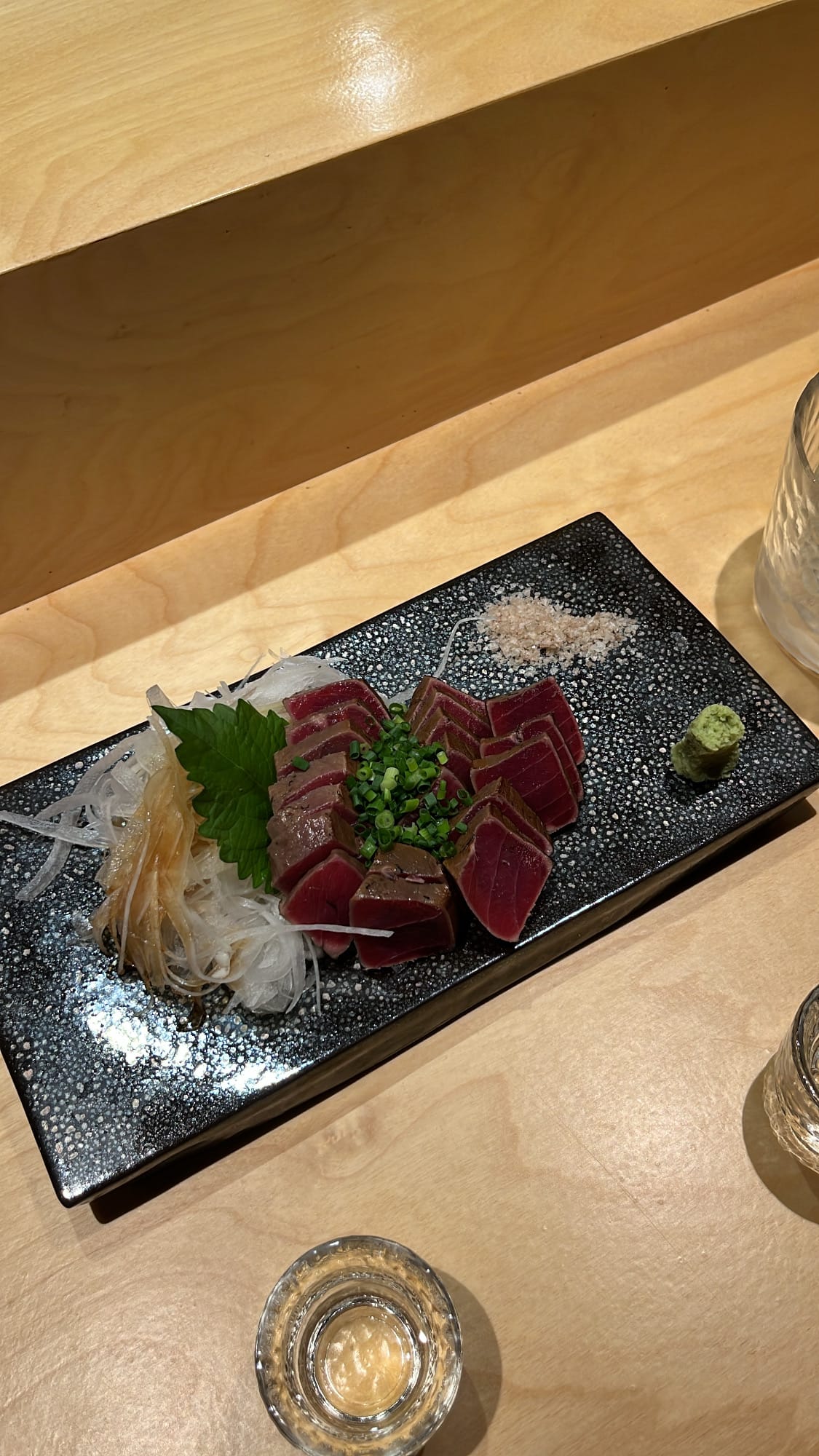 Overhead view of thick-cut smoked maguro tataki dish at Murasaki Busan
