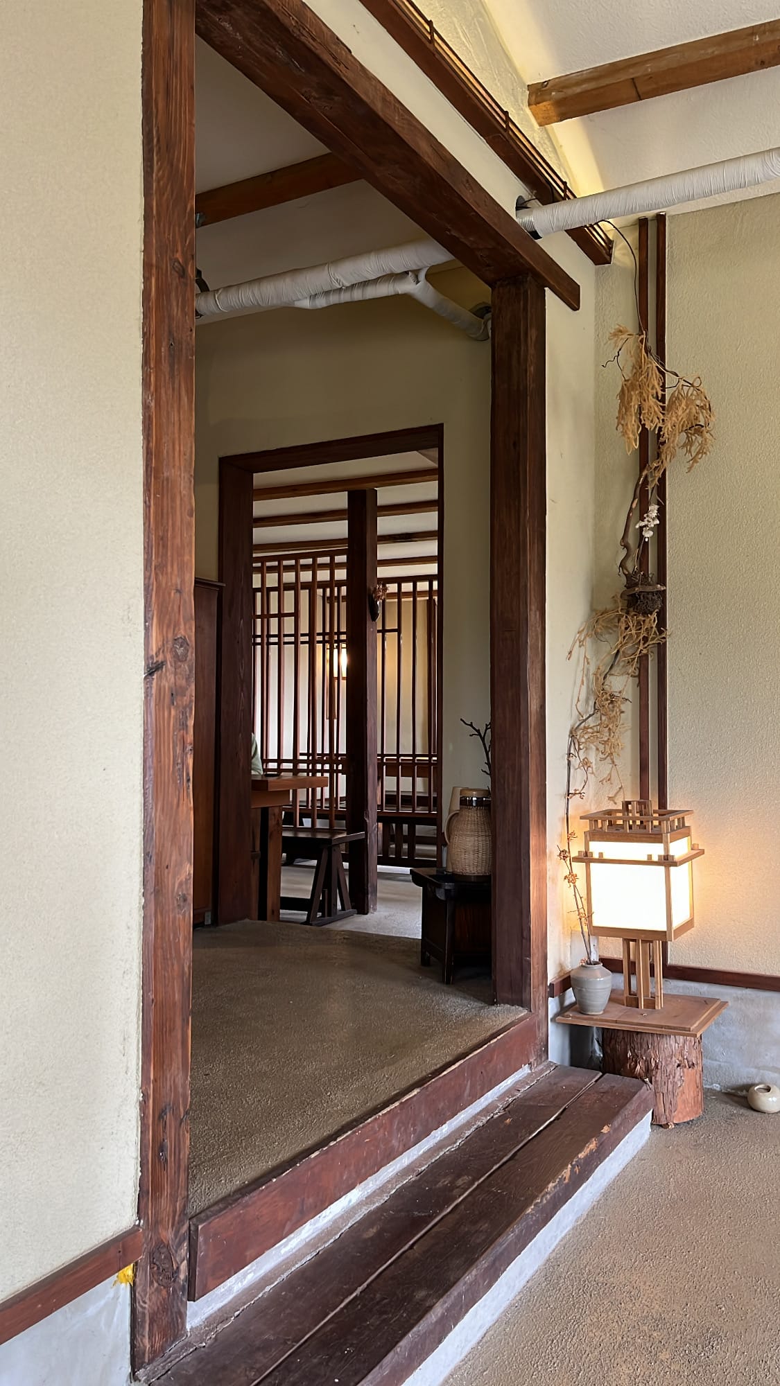 Atmospheric wooden corridor and private tea seating rooms inside Simmian Busan