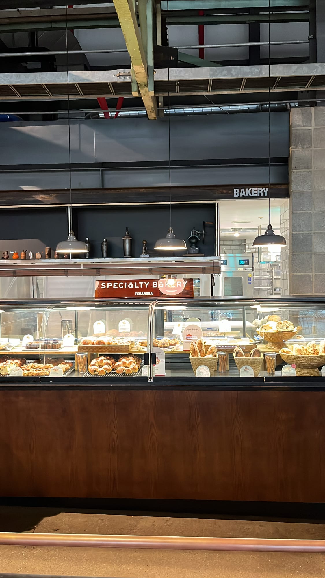 Dedicated specialty bakery section and pastry counter at Terarosa