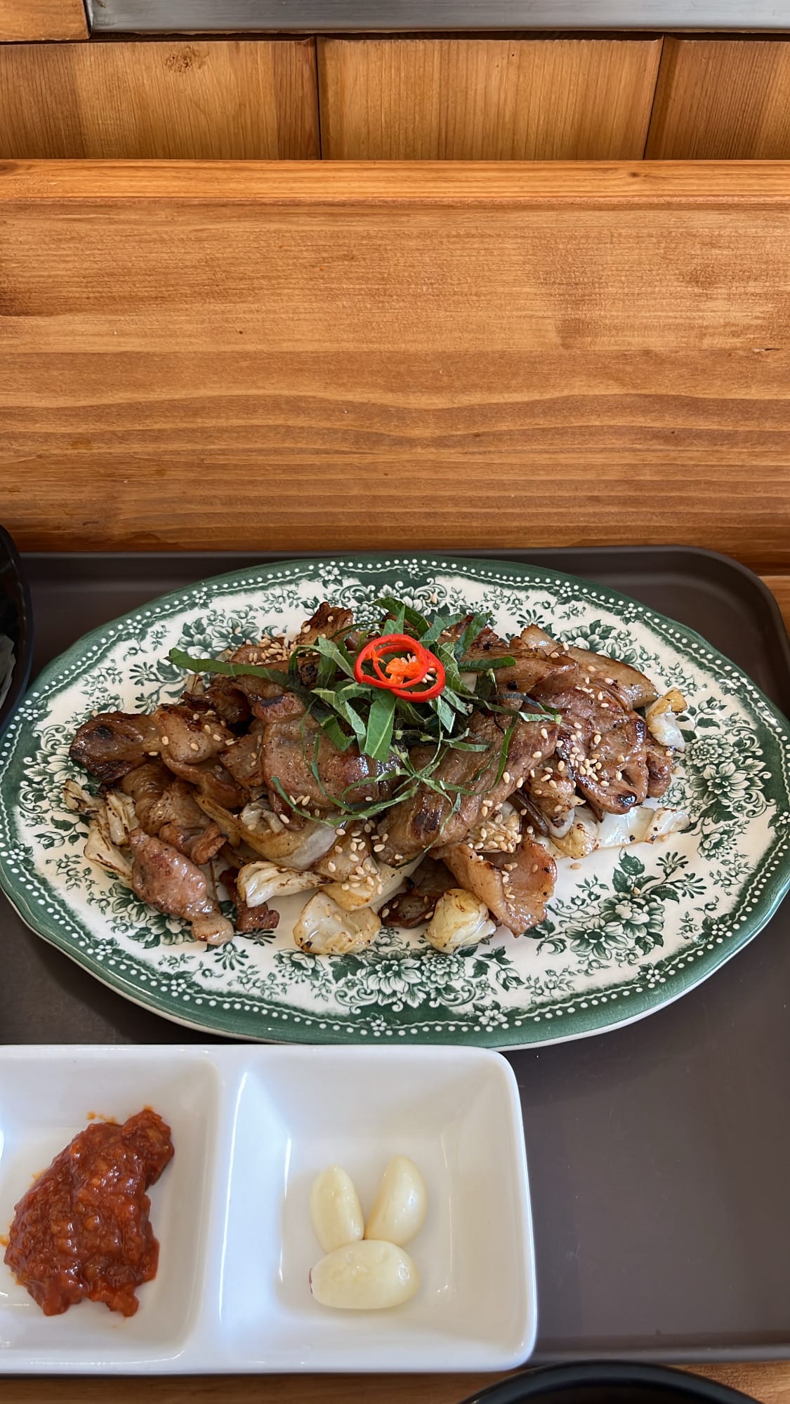 Platter of savory soy sauce marinated pork bulbaek with cabbage at Chef202 Busan