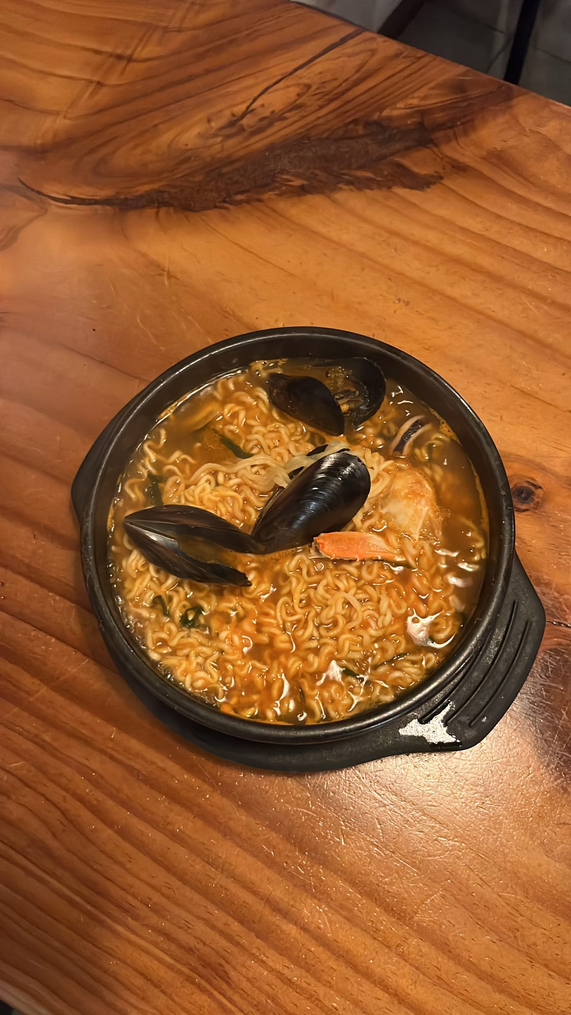 Close-up view of comforting spicy seafood ramen at Yeokjeon Grandma Beer Centum City