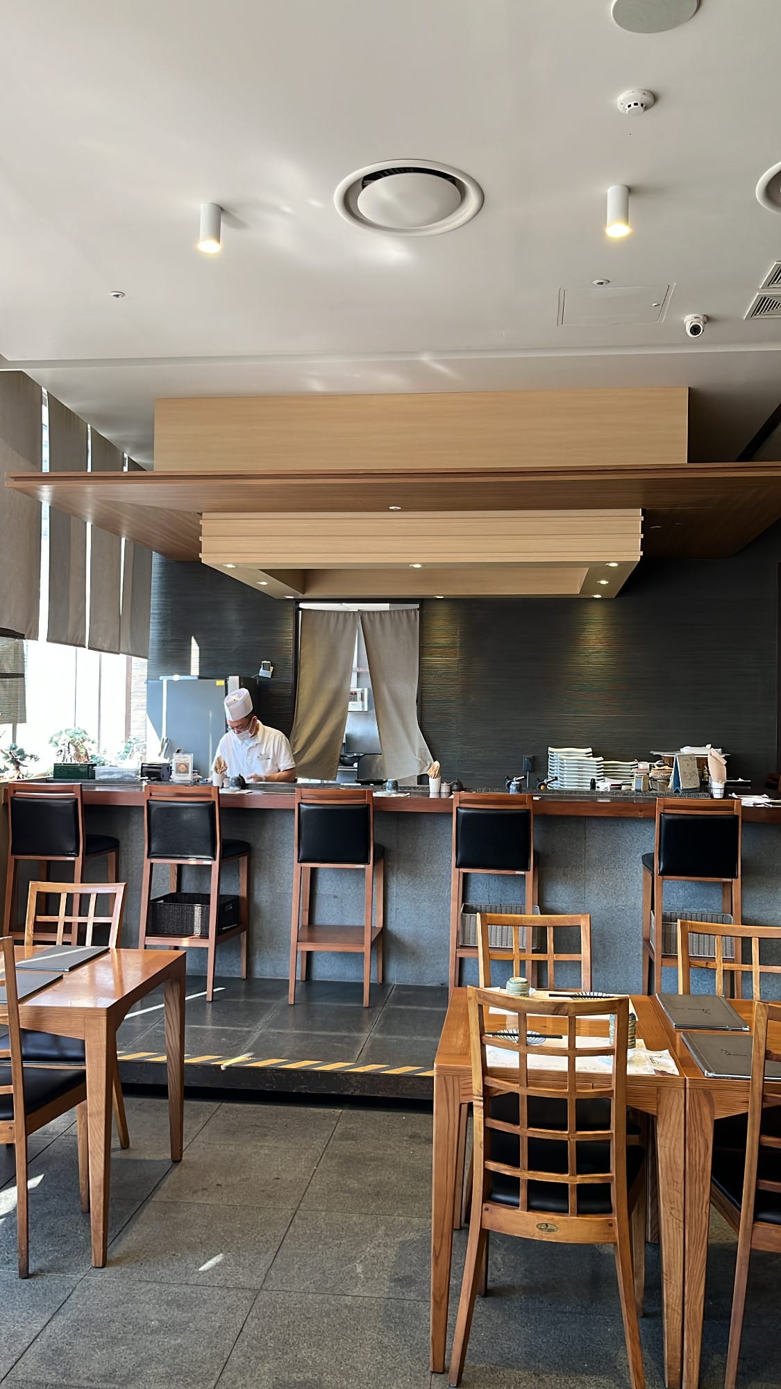Wood-accented omakase sushi counter at Moon Sushi Busan