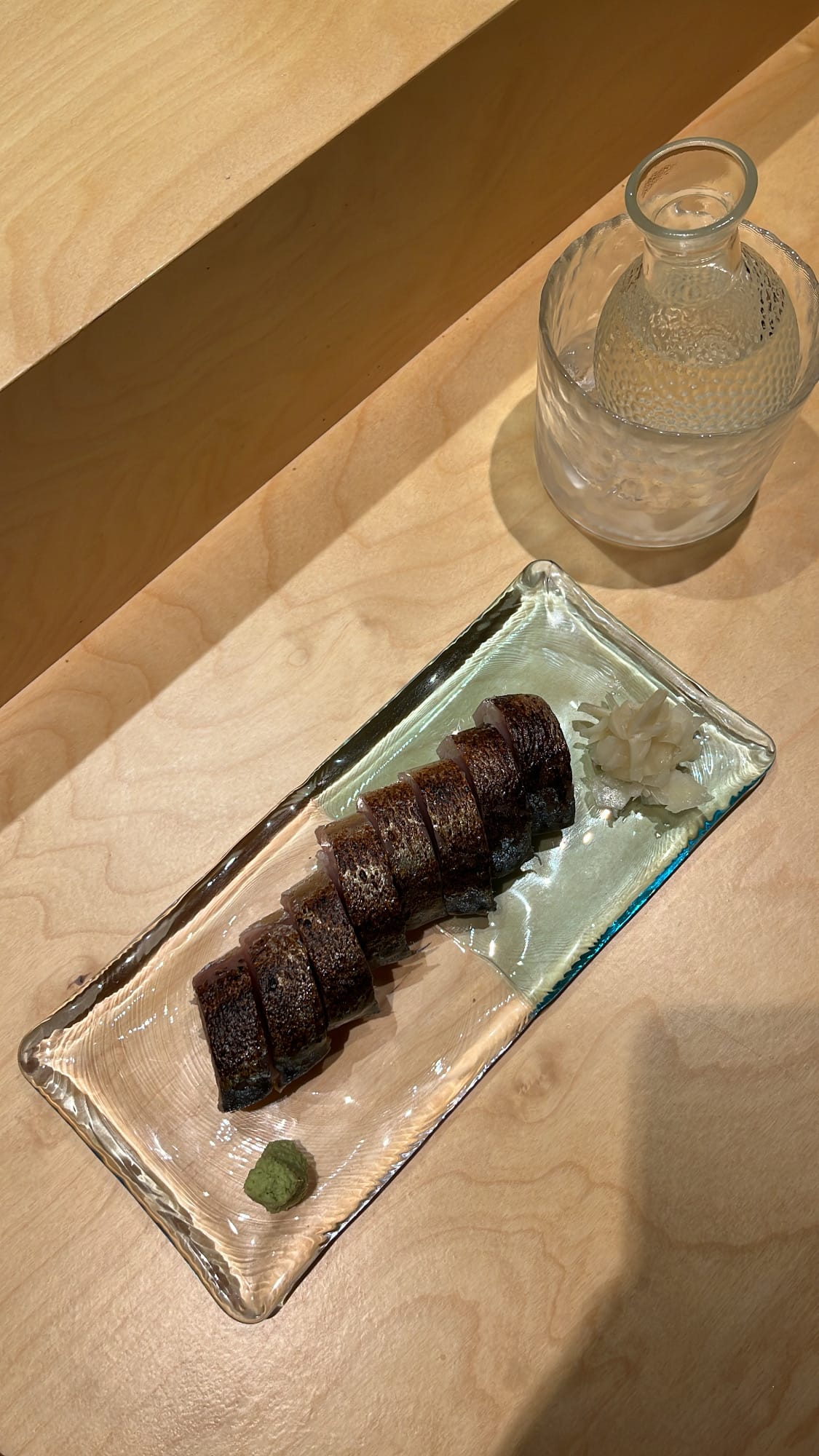 Overhead shot of aburi saba bousushi with pickled ginger at Murasaki Busan