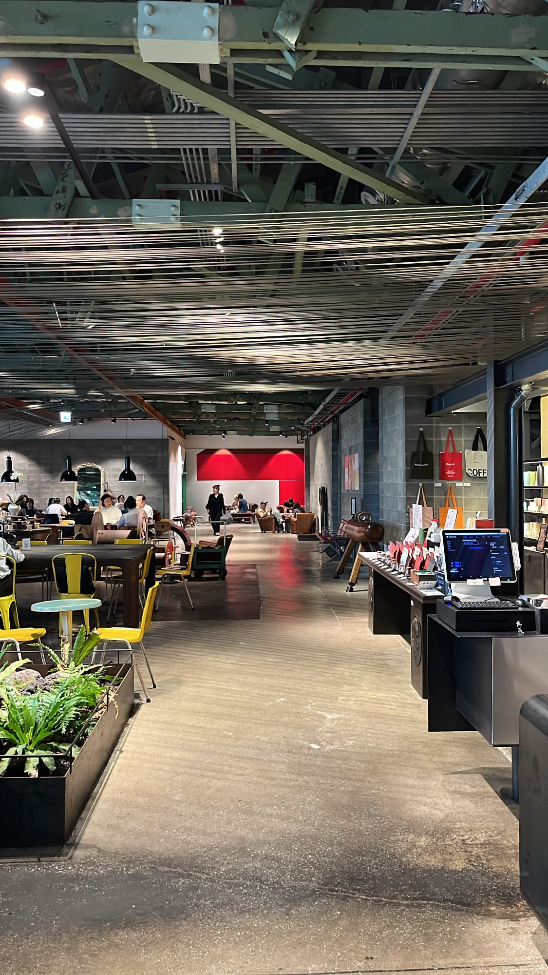 Wide warehouse interior hallway and merchandise counter at Terarosa Suyeong