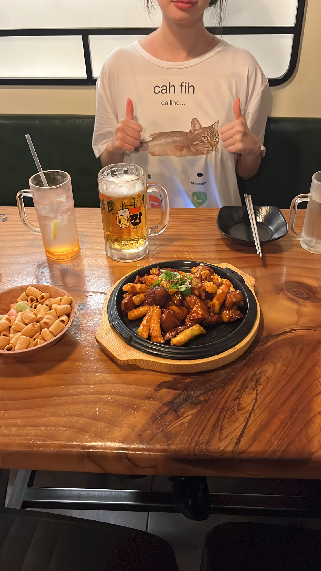 Cozy pub table with food and beer at Yeokjeon Halmeoni Centum