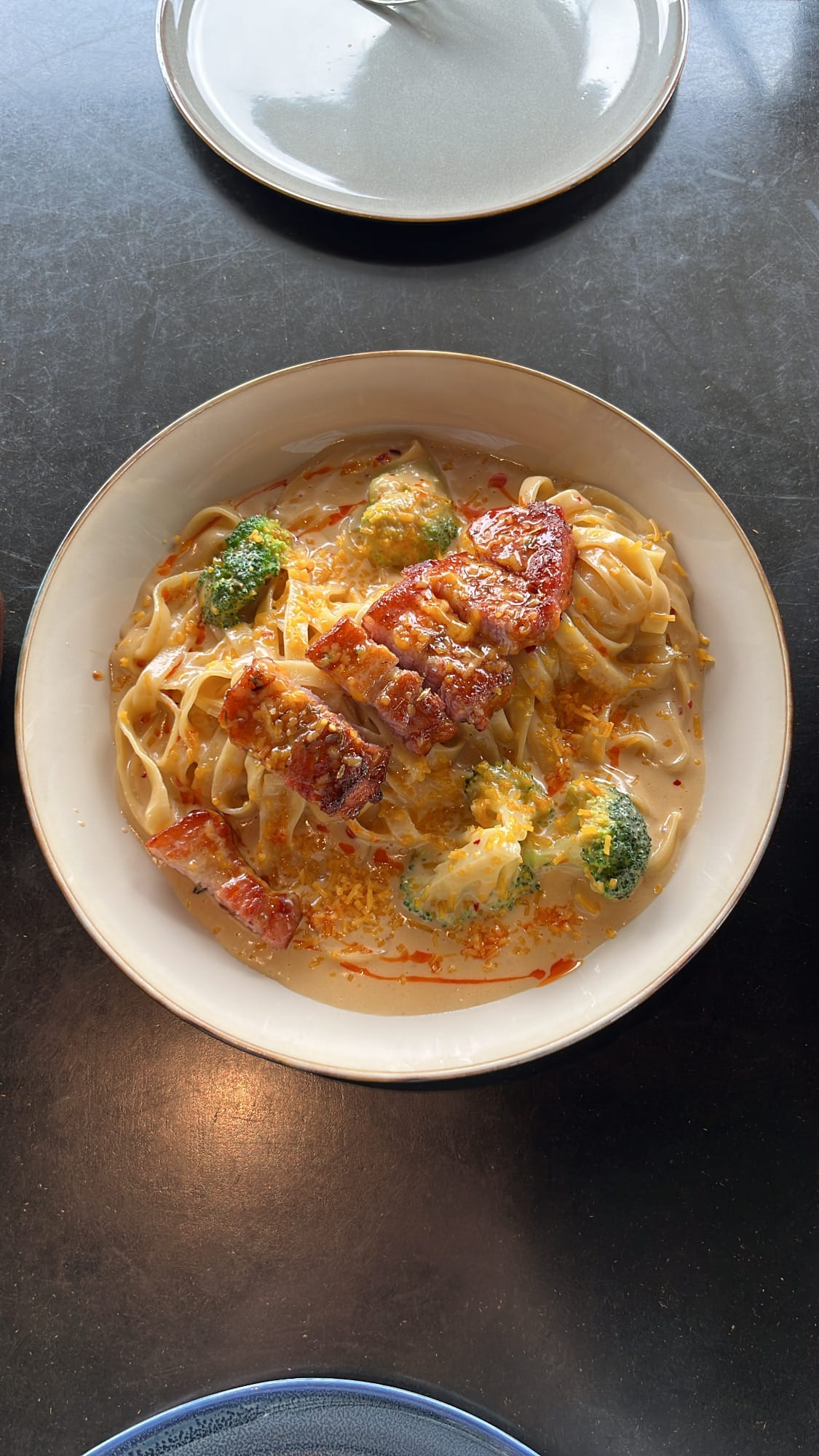 Creamy Toowoomba fettuccine pasta topped with thick-cut glazed bacon