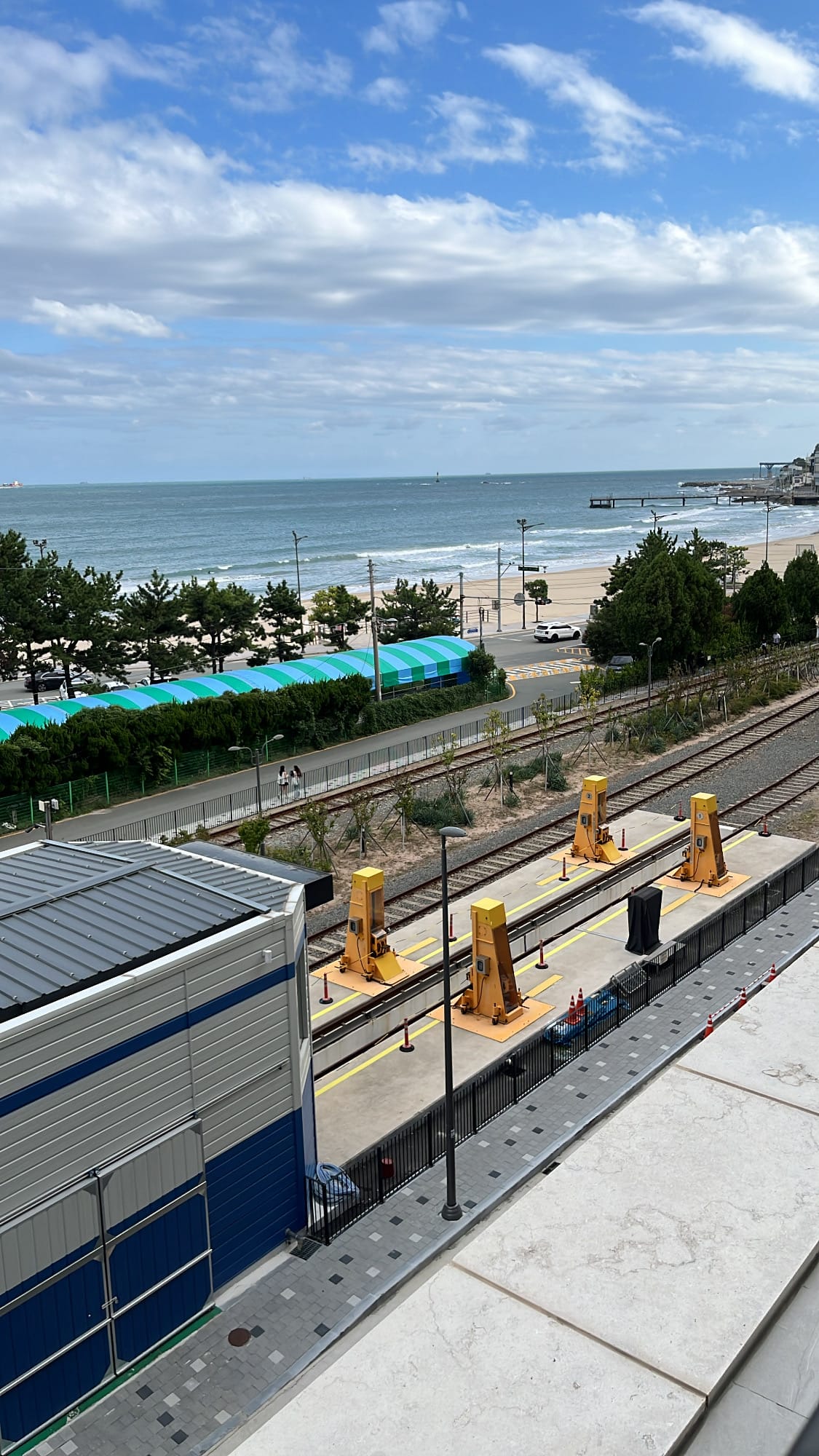 Elevated view of Songjeong Blueline Park station tracks from The Coolest Hotel