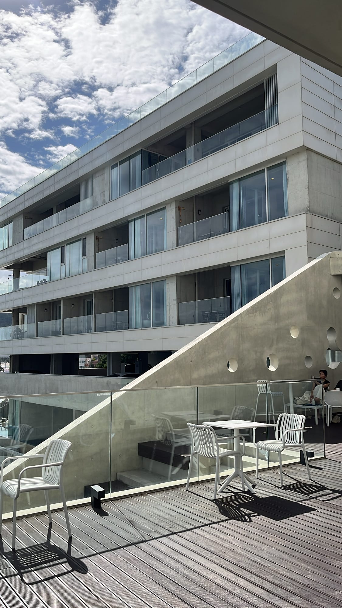 Neighboring modern pool villa hotel viewed from the terrace of Coralani Busan