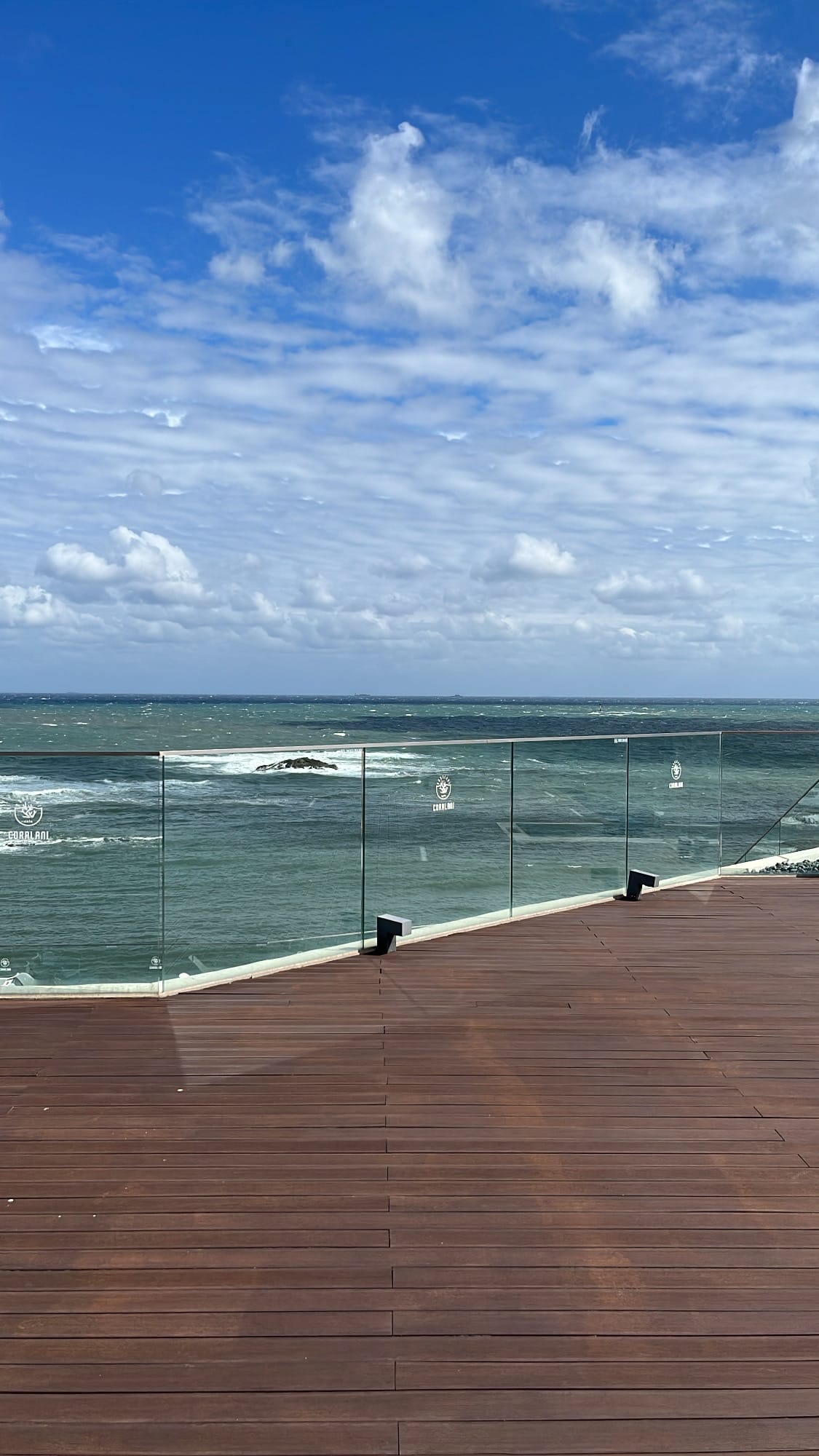 Expansive timber planked rooftop viewing deck on the fourth floor of Coralani Busan