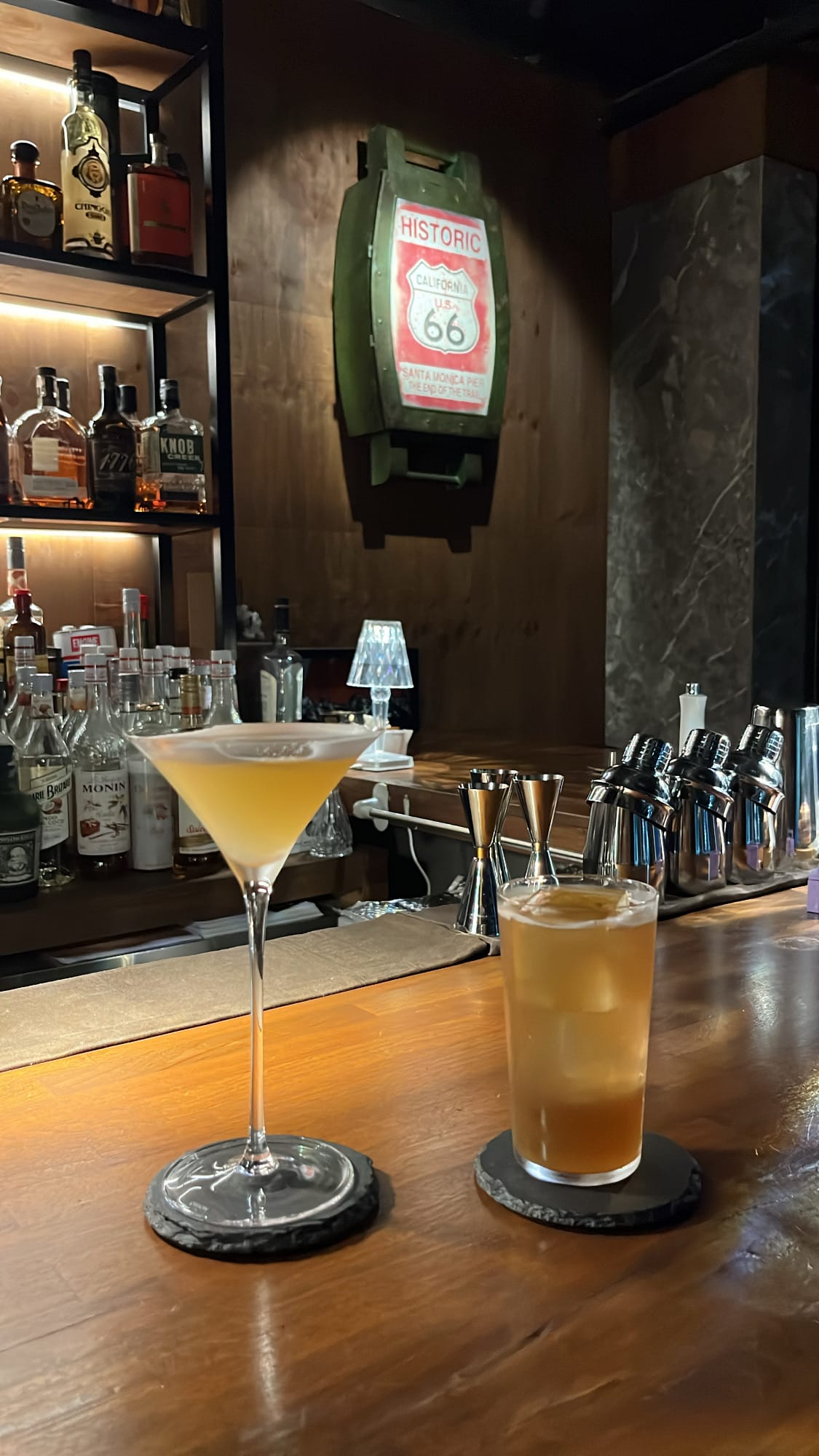 Handcrafted cocktails served on wooden counter at Bar Railside